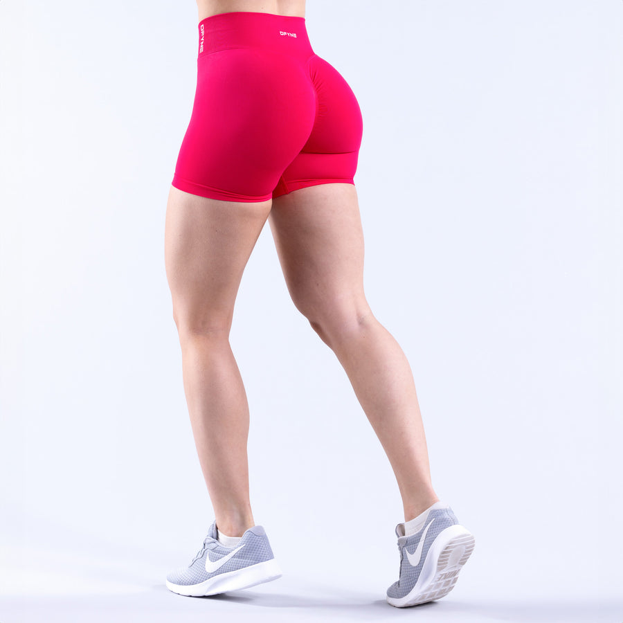 Fuchsia athletic shorts with smooth back and waistband logo