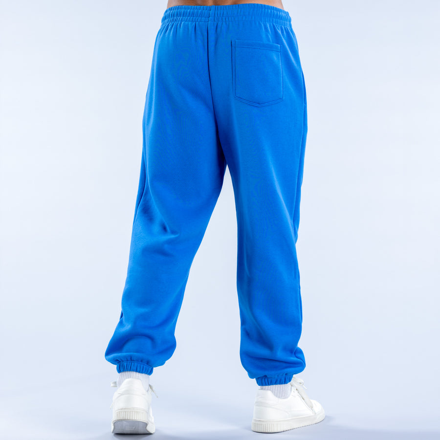 Blue cuffed jogger pants with elastic waistband and back patch pocket.