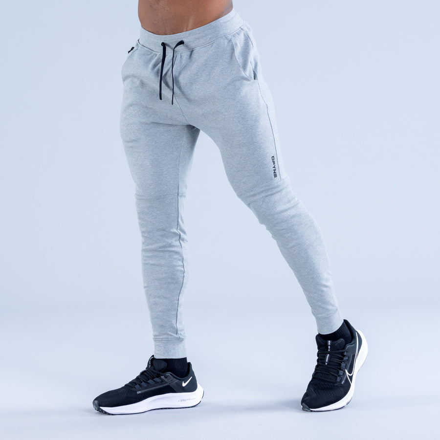 Light gray tapered jogger pants with drawstring waist and side pocket