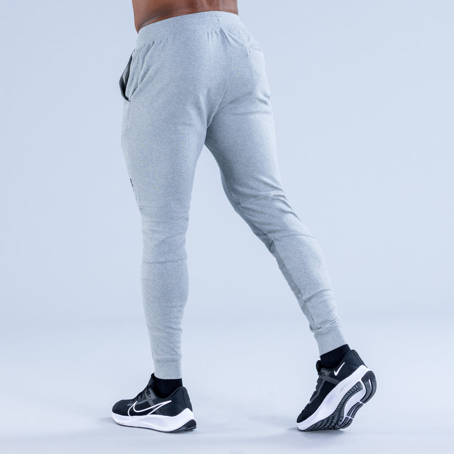 Light gray tapered jogger pants, back view with drawstring waist