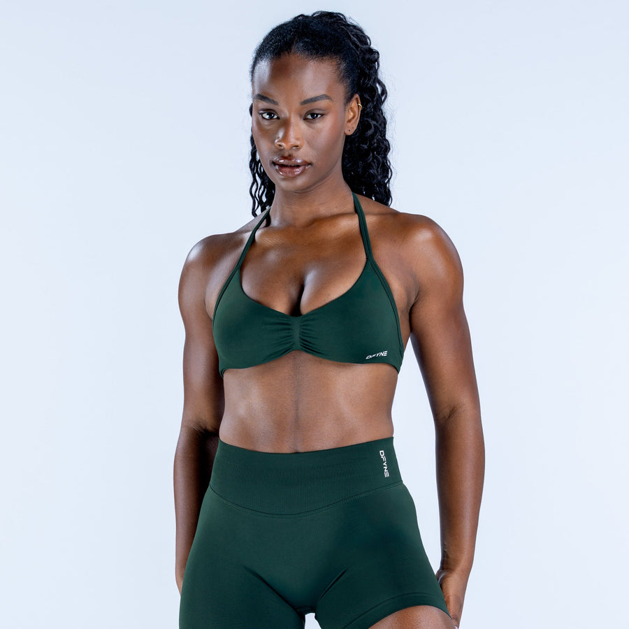 Impact strappy bra in dark green, front view with halter straps and molded cups