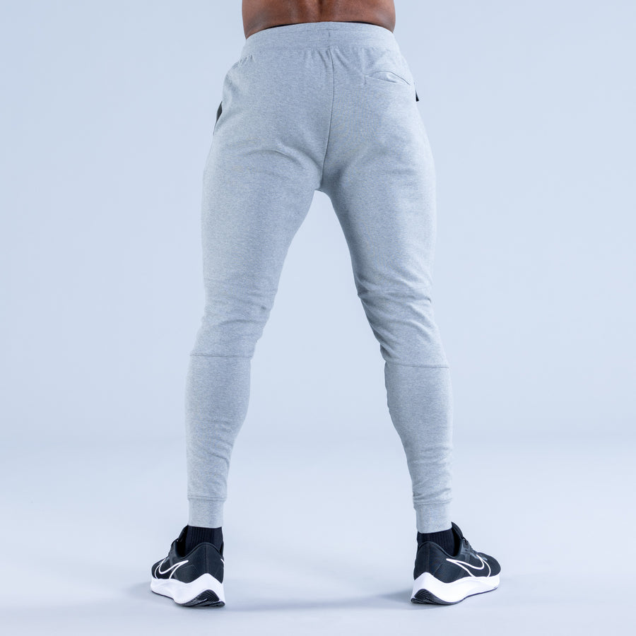 Light gray tapered jogger pants, back view with gathered waistband