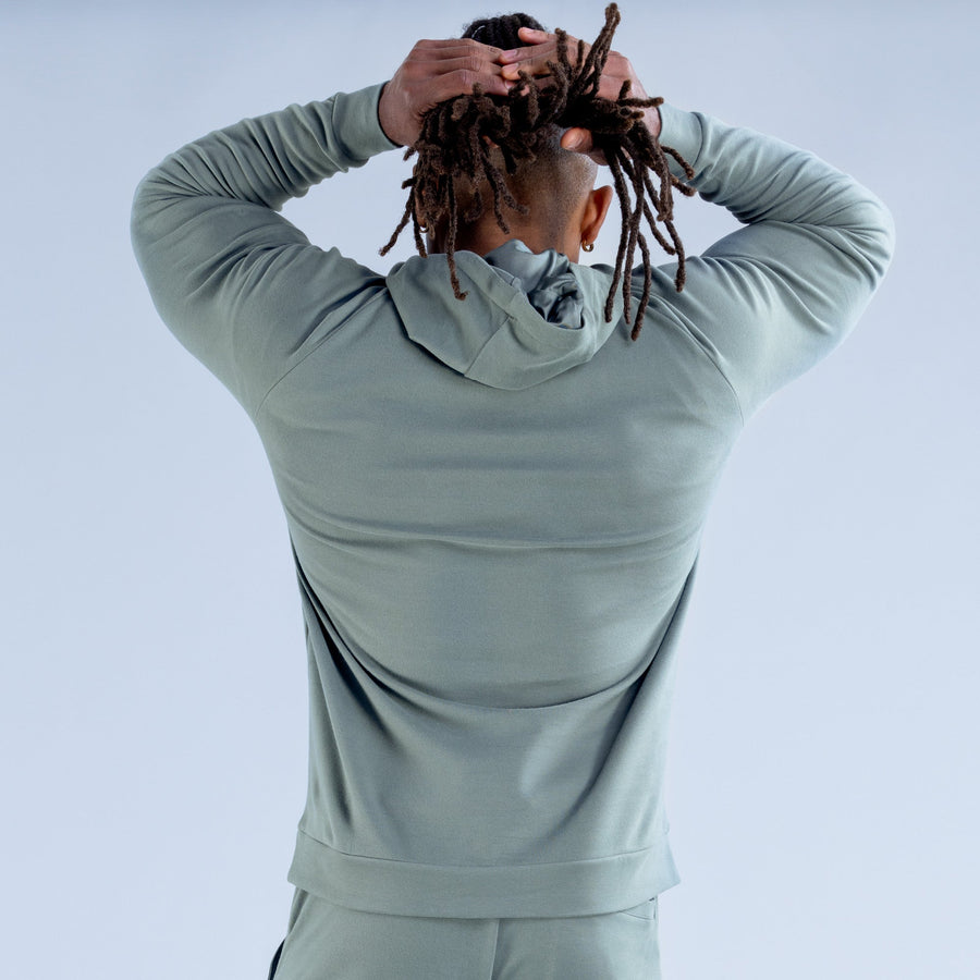 Sage green hoodie back view with drawstring hood and kangaroo pocket opening