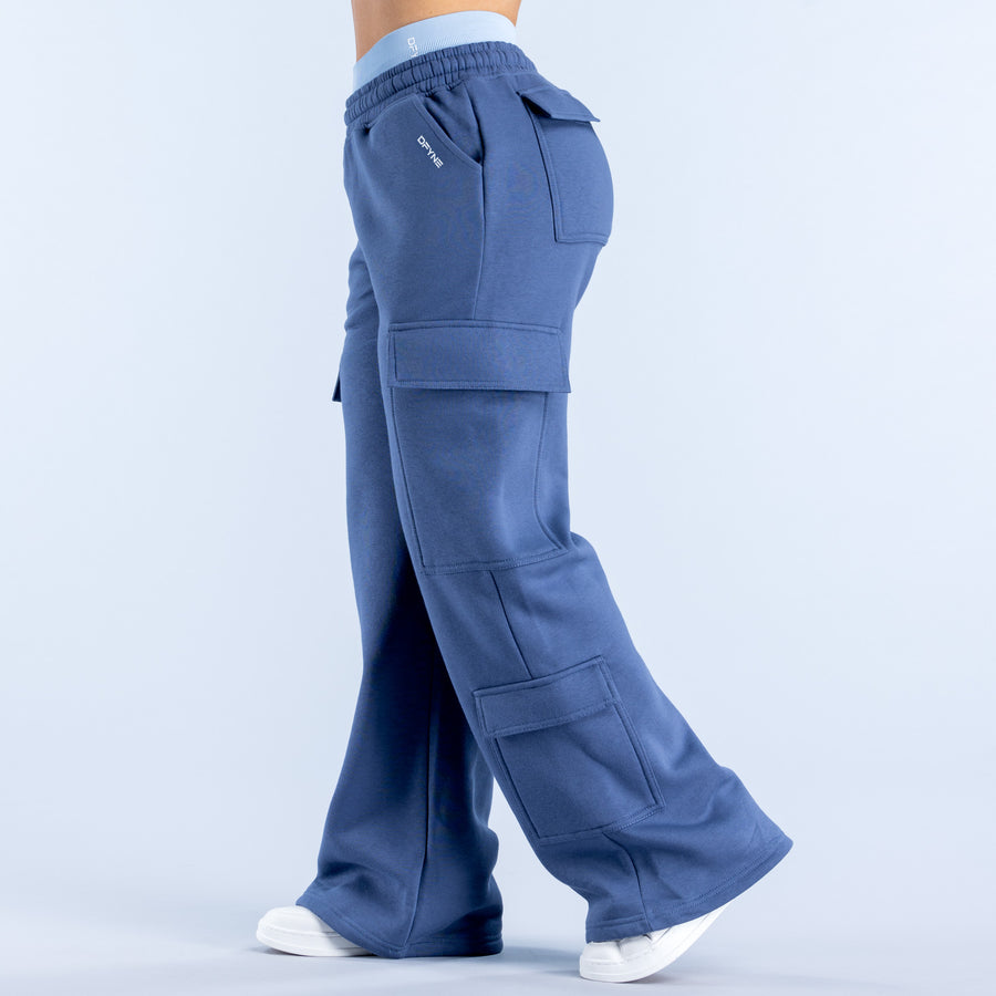 Blue cargo jogger pants with multiple cargo pockets and elastic cuffs, side view