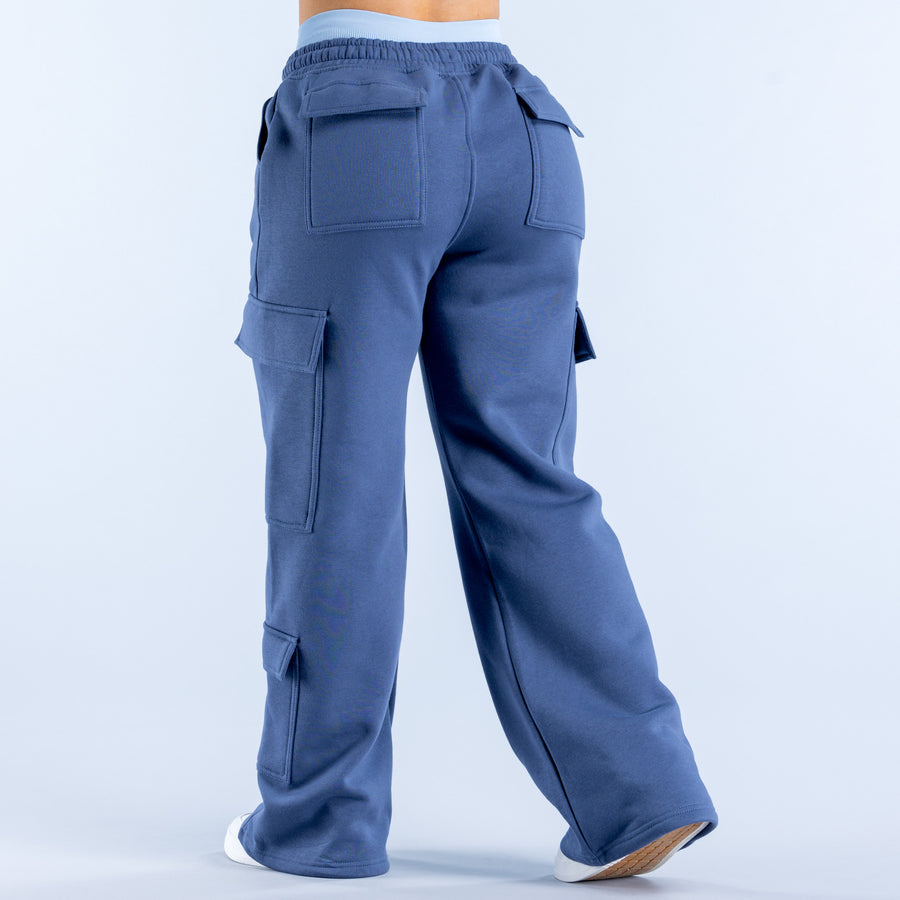 Blue cargo jogger pants, back view, elastic waistband and patch cargo pockets
