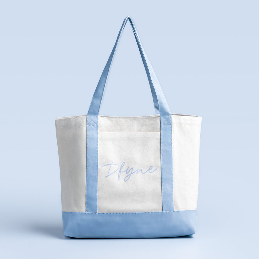 Two-tone canvas bag with long handles and front panel logo