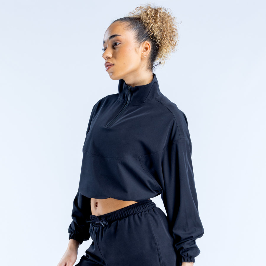 Black cropped zip jacket with high collar, zip front, elastic cuffs, cropped fit