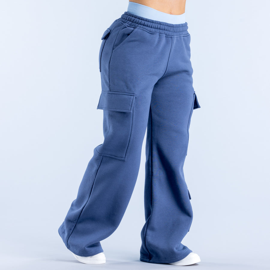 Blue cargo jogger pants with elastic waistband and cargo flap pockets, loose wide leg