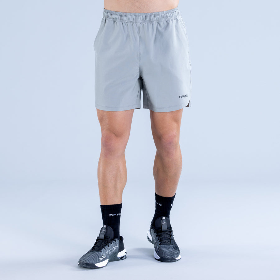 Light blue training shorts with elastic waistband and small DPYNE logo