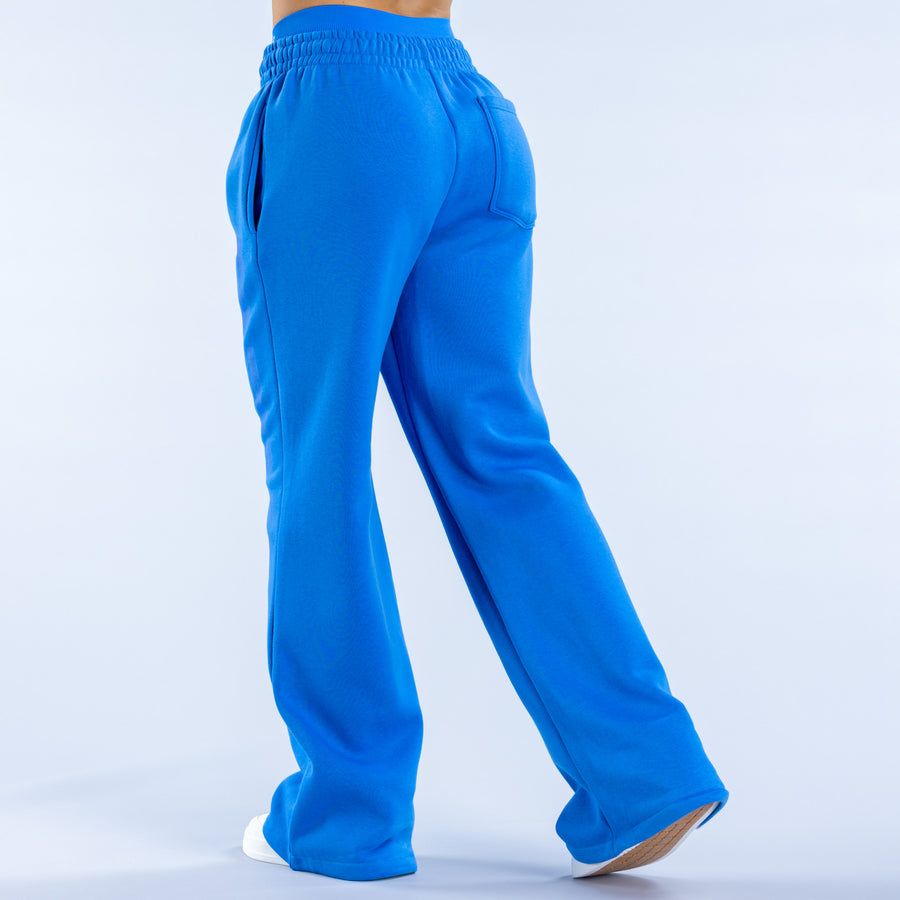 Blue wide-leg joggers, back view, elastic waist and two side pockets