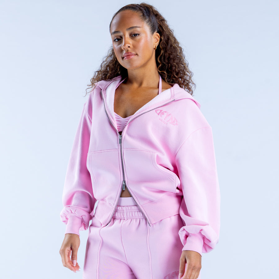 Pink zip-up hoodie with hood and front zipper; small chest logo