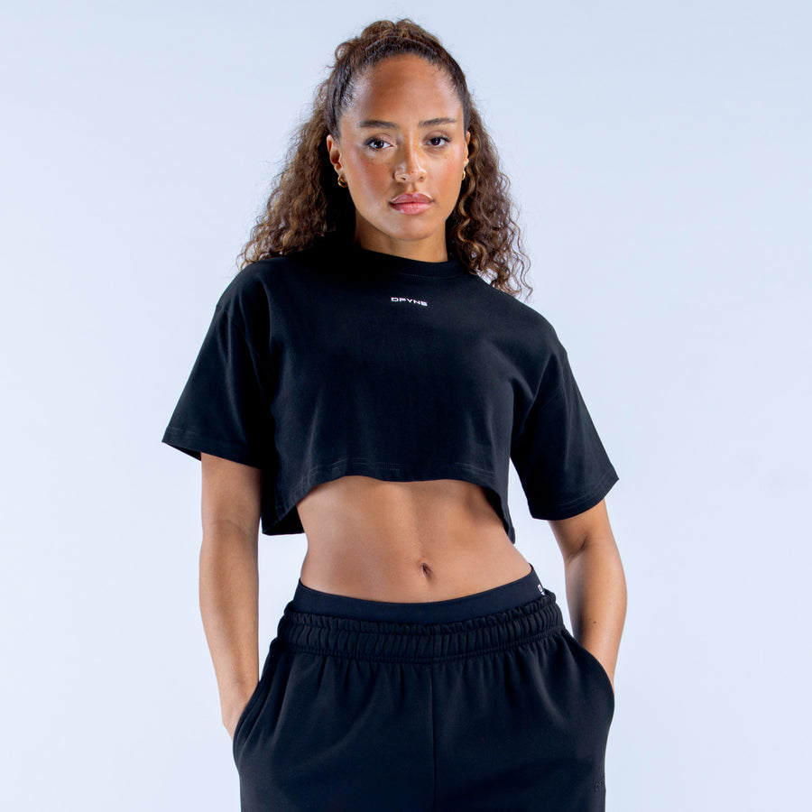 Black crop T-shirt with crew neck and short sleeves, front view
