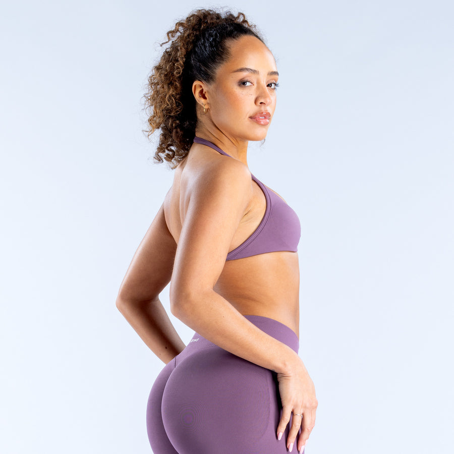 Impact strappy bra in purple, side view with ruched cups and slim straps