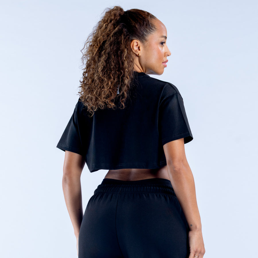 Black crop T-shirt with crew neck and short sleeves, back view