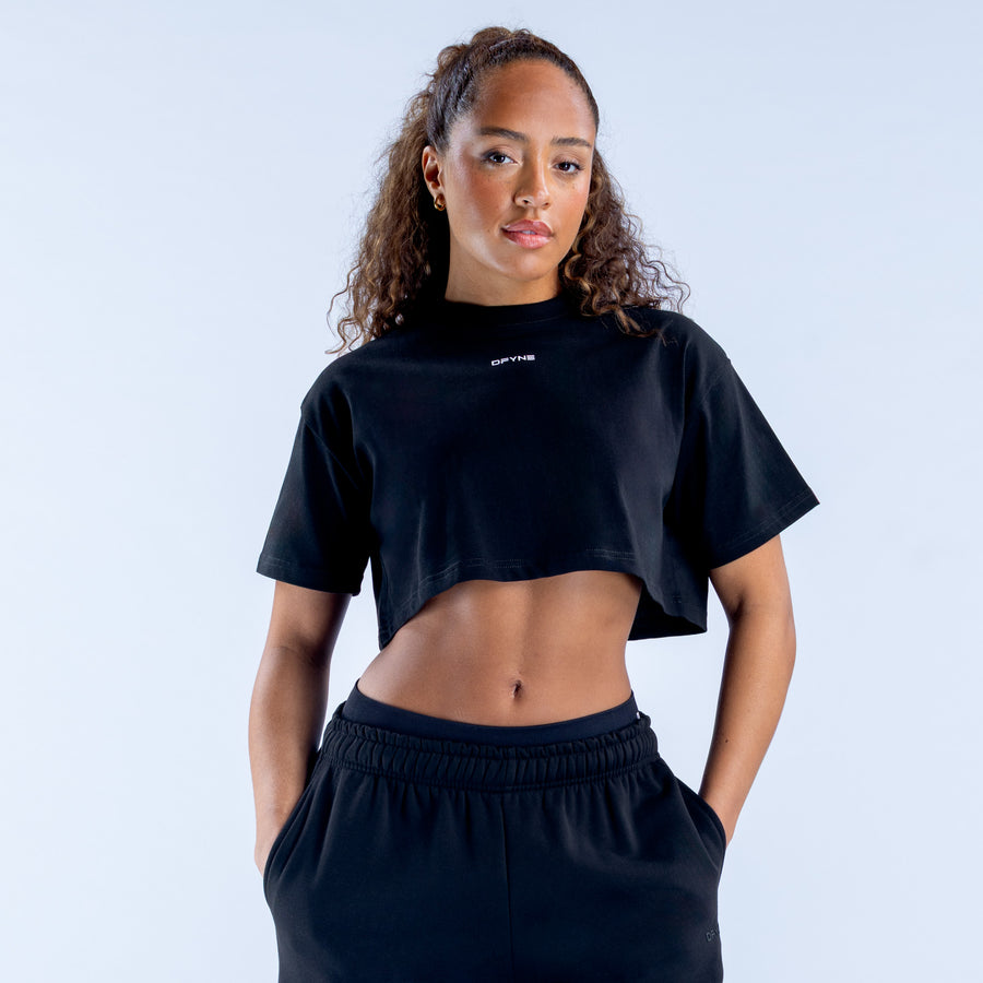 Black crop T-shirt with small chest logo, crew neck and short sleeves