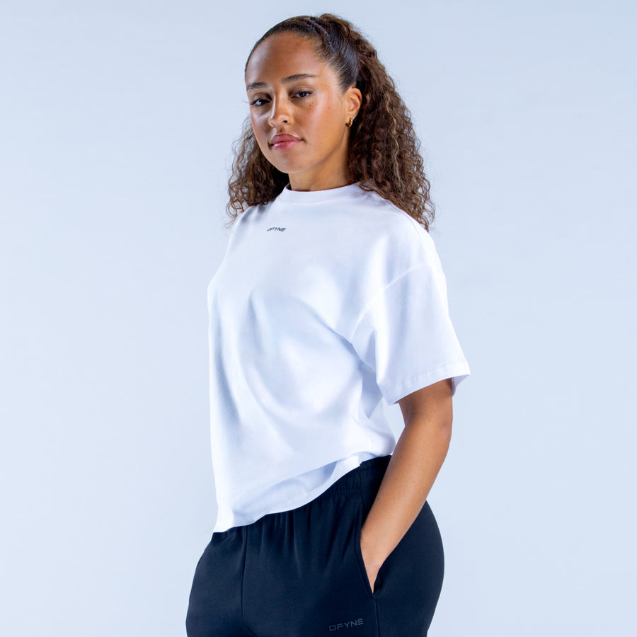 White boxy crew-neck tee with short sleeves and small chest logo