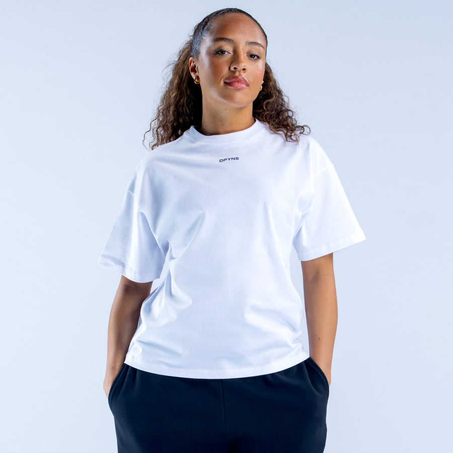 White boxy crew-neck tee with short sleeves and small center chest logo