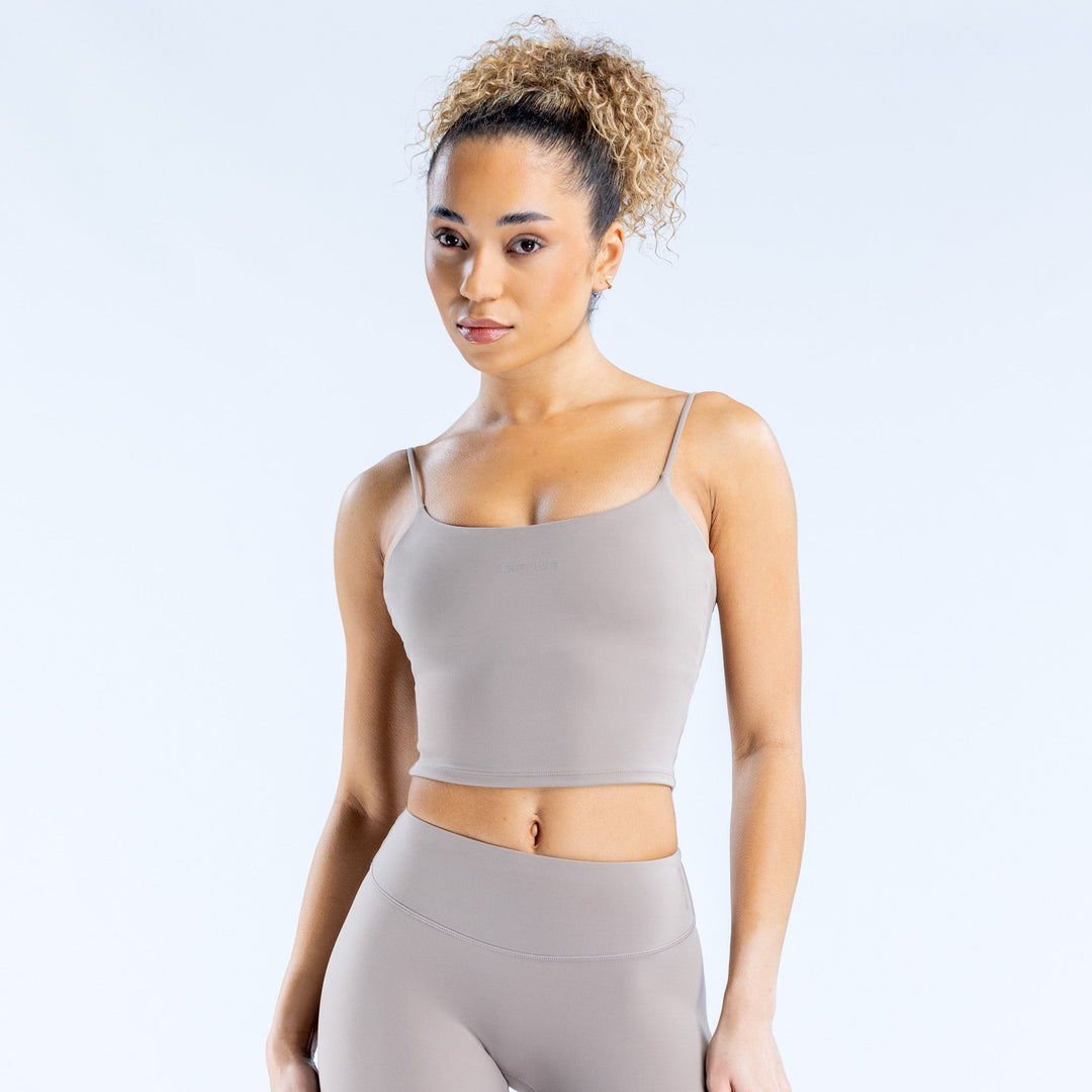 Gray strappy cropped tank top with thin spaghetti straps and straight neckline