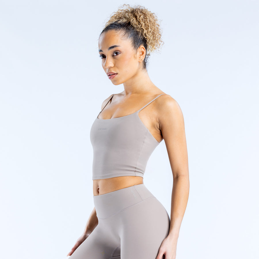 Light gray strappy crop top with spaghetti straps and straight neckline