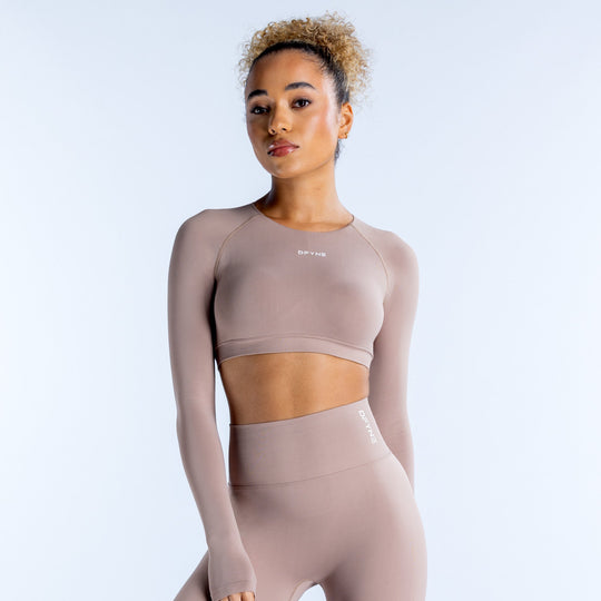 Mocha taupe long-sleeve crop top with crew neck and fitted stretch fabric.
