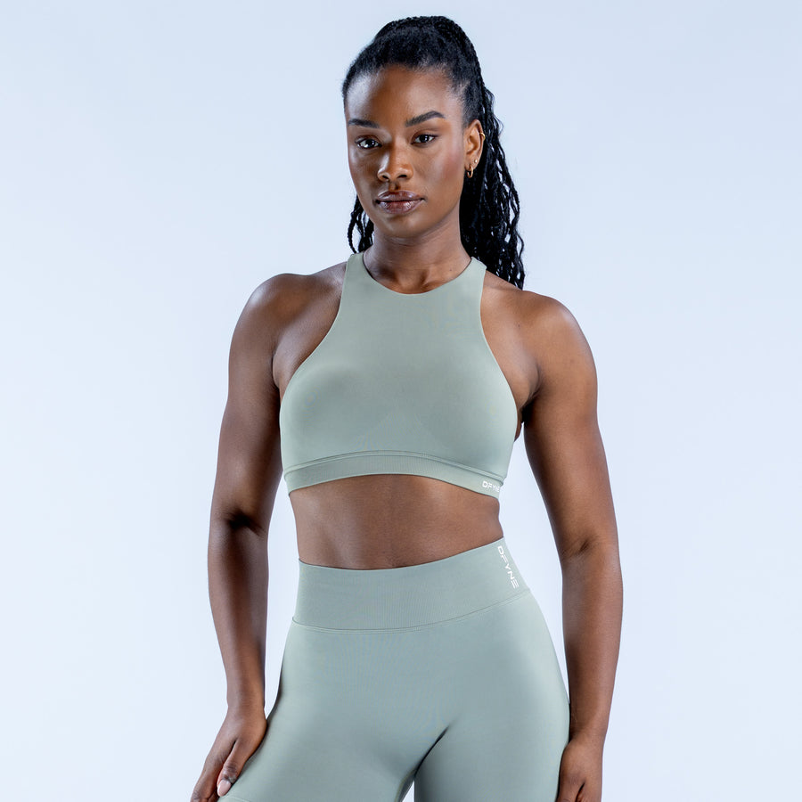 Sage green racerback sports bra with racerback straps and cropped fit