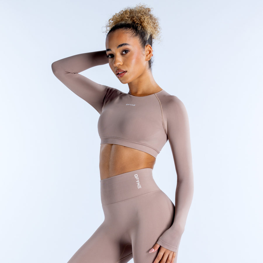 Mauve long-sleeve crop top with high crew neckline and smooth fitted fabric