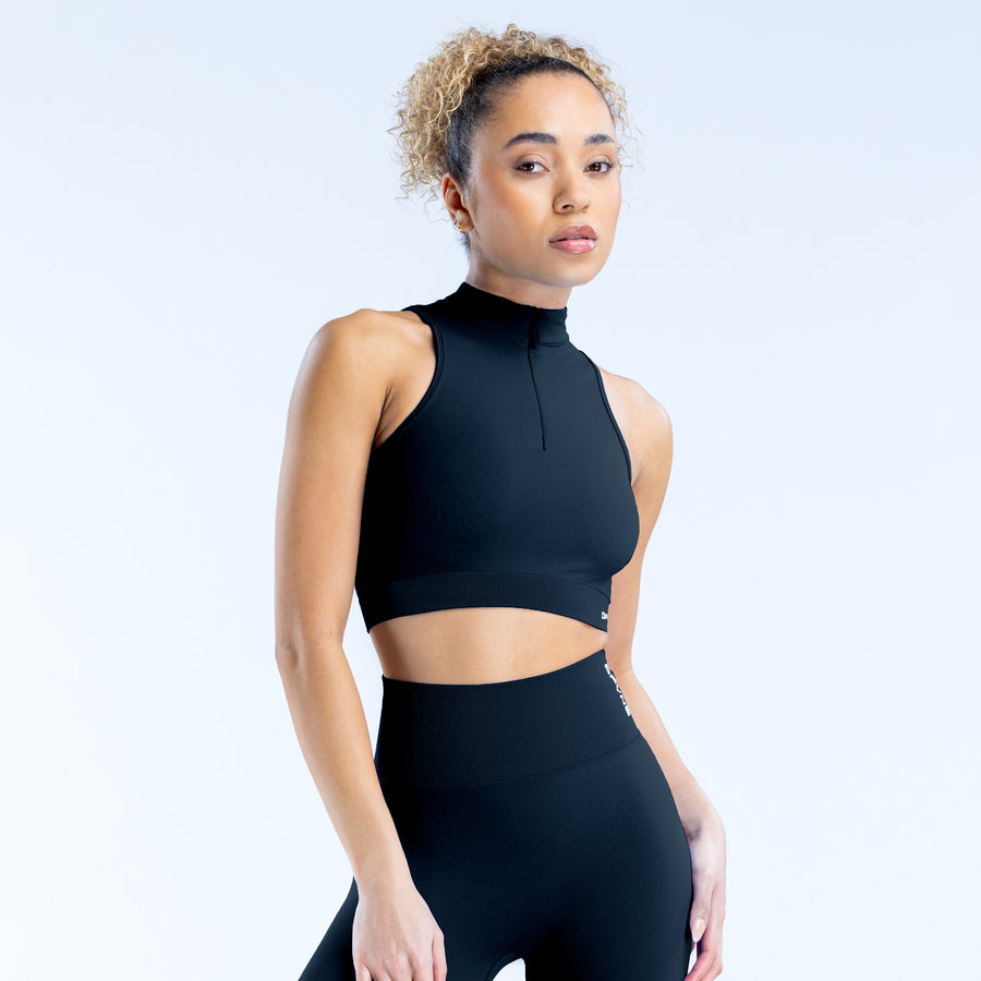 Black dynamic quarter-zip tank top with sleeveless high collar and cropped length