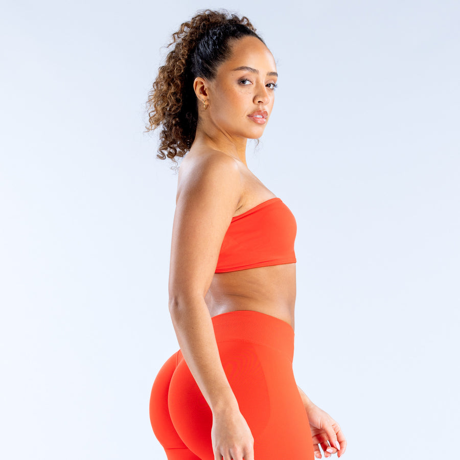 Backless bandeau sports bra in red with smooth, supportive fit
