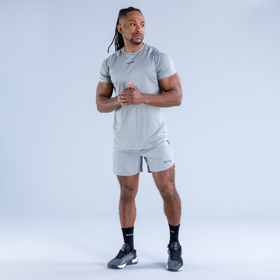 Light blue crew-neck training T-shirt with small chest logo and short sleeves