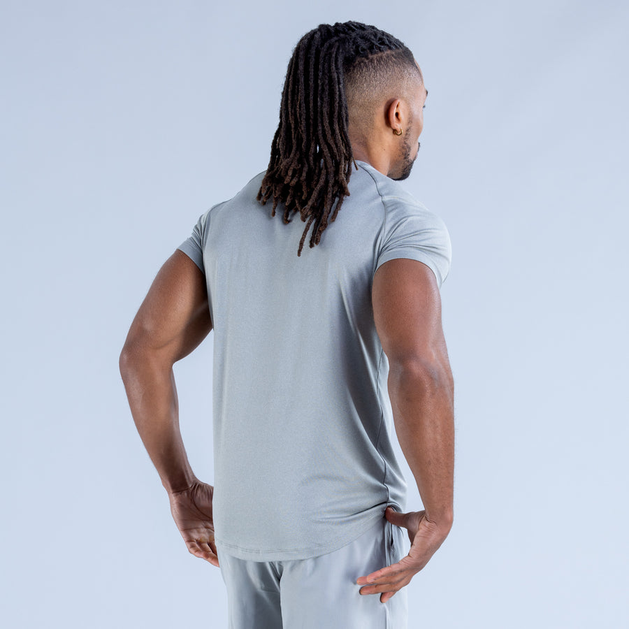 Light blue training T-shirt back view with crew neck and short sleeves, small logo