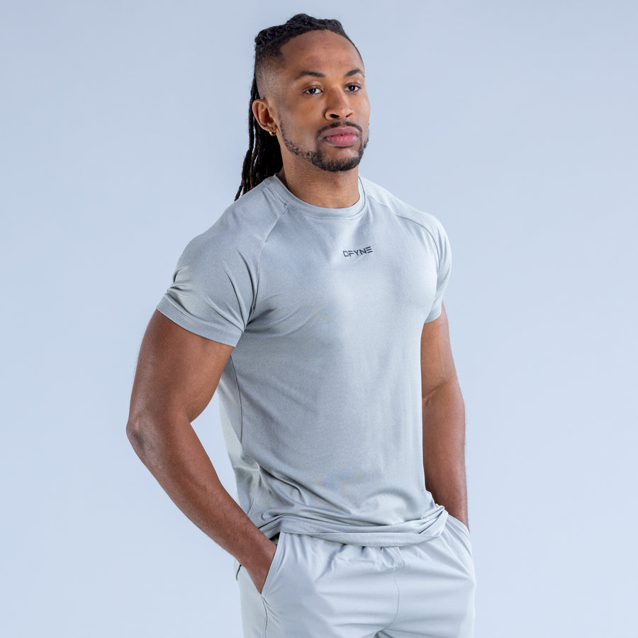 Light blue crew-neck training T-shirt with chest logo and fitted short sleeves