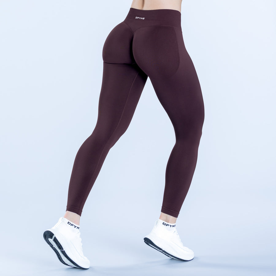 Burgundy impact leggings with shaped rear panels and high-rise waistband.