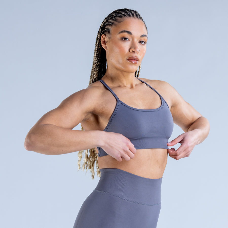 Backless sports bra in muted blue with scoop front and thin shoulder straps
