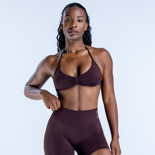 Impact strappy bra in dark plum with gathered center and halter straps