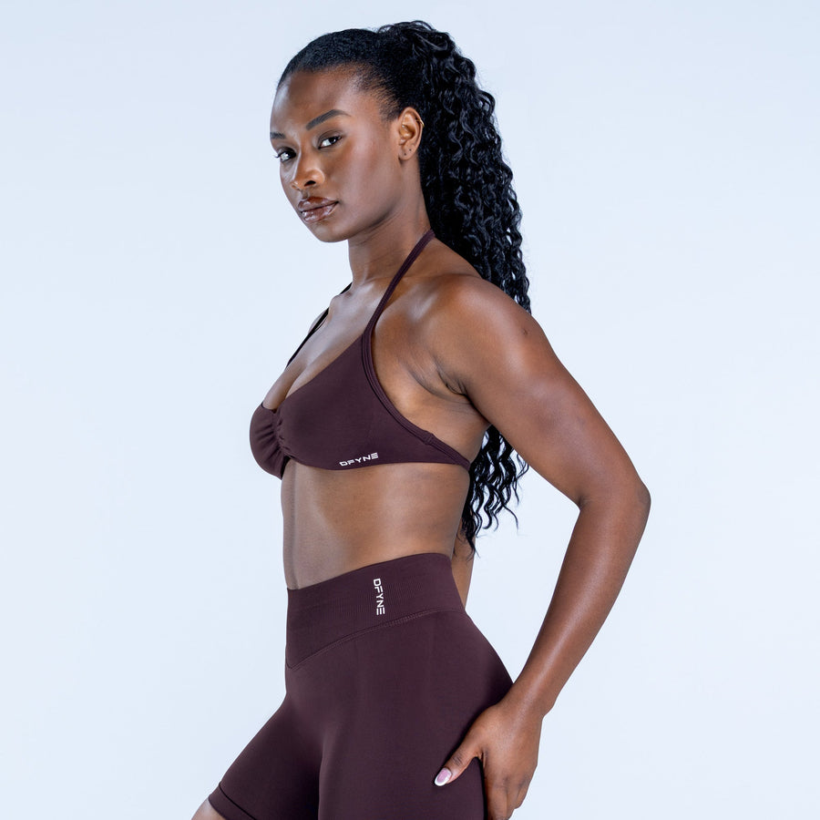 Impact strappy bra in dark plum with halter straps and small logo patch