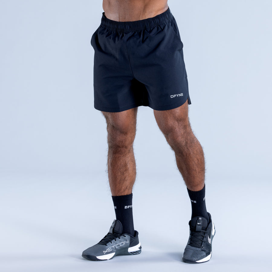 Training shorts, dark with elastic waistband and small thigh side logo.