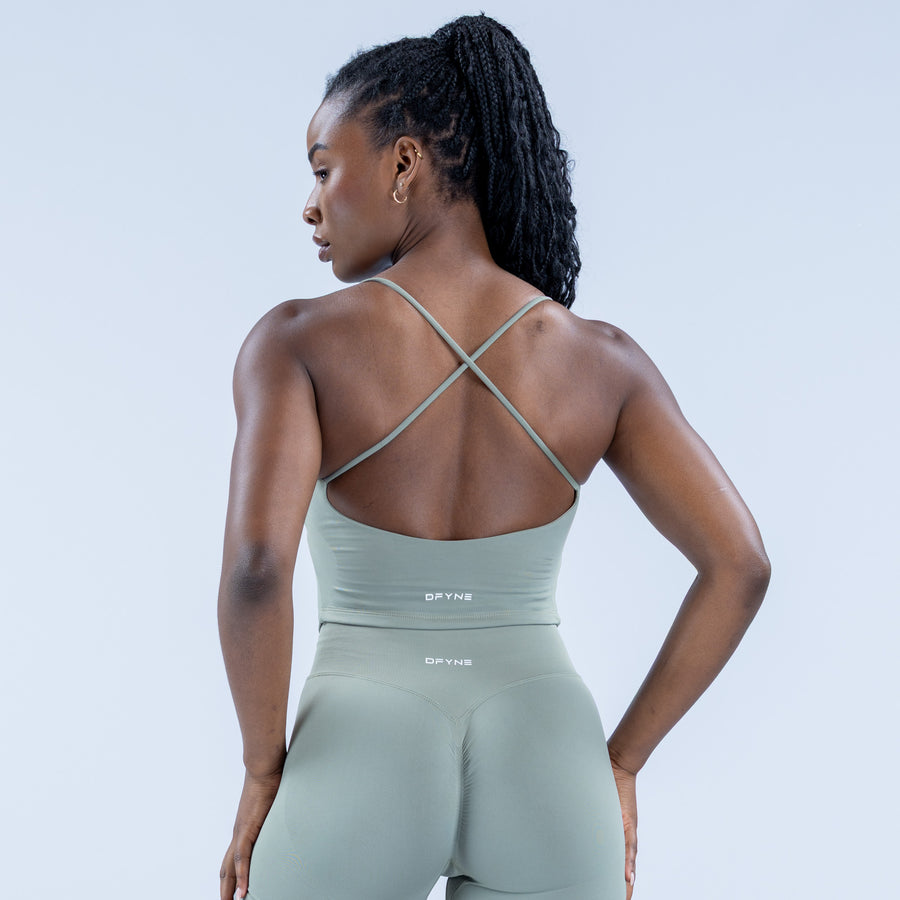 Mint green strappy sports top with crisscross back straps and scoop back