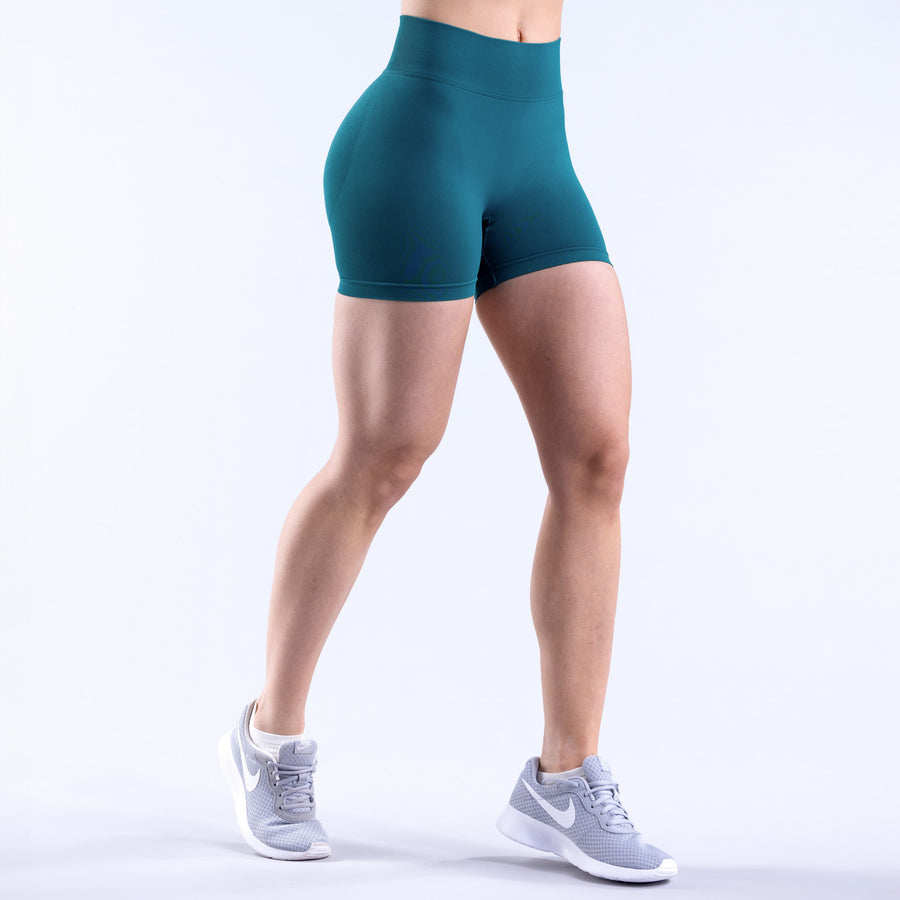 Teal women's mid-thigh shorts with smooth front and elastic waistband