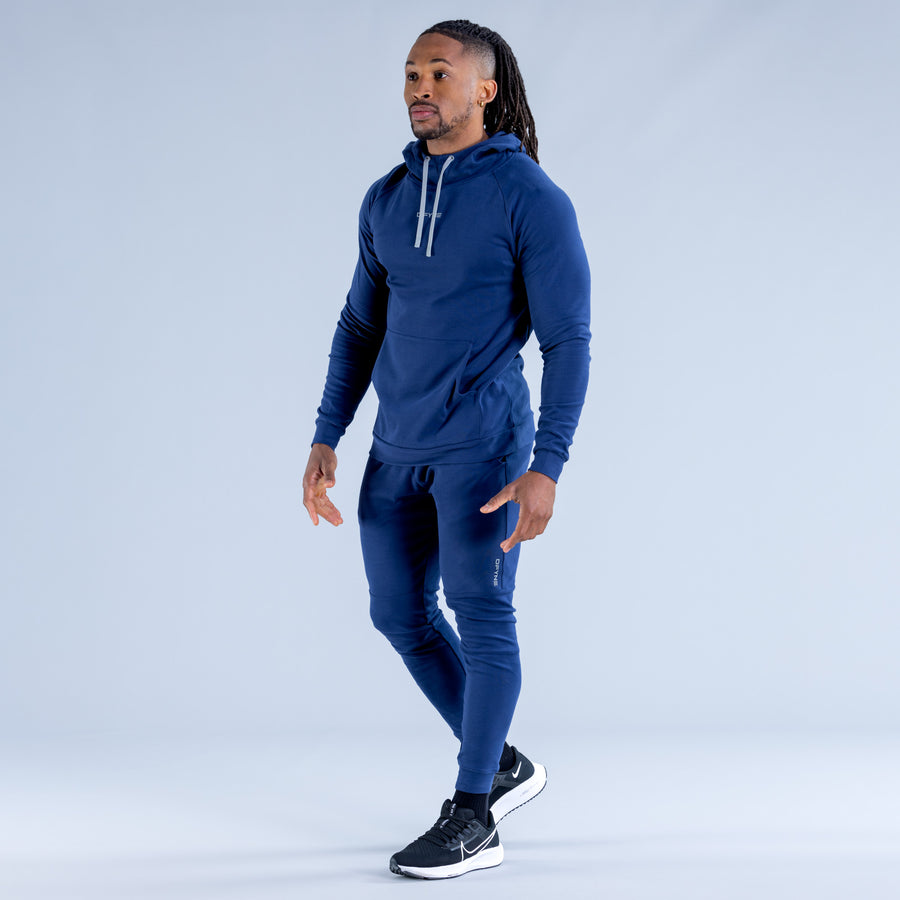 Midweight blue pullover hoodie with hood, front kangaroo pocket, and ribbed cuffs