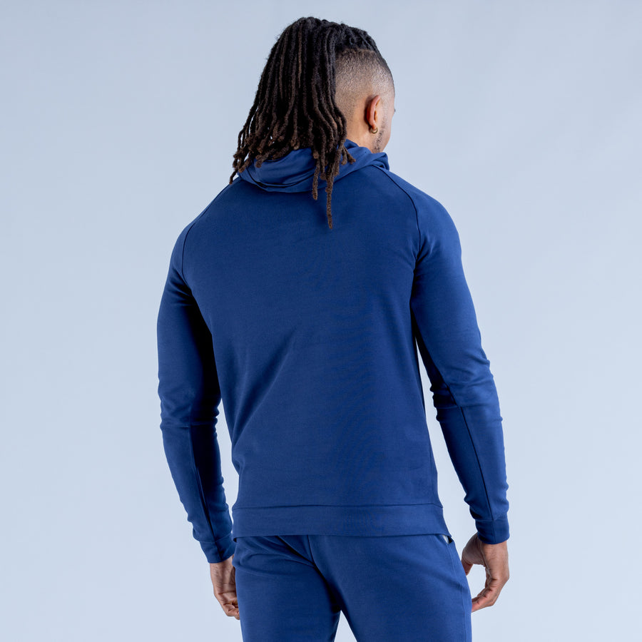 Midweight blue pullover hoodie with hood and ribbed hem, back view