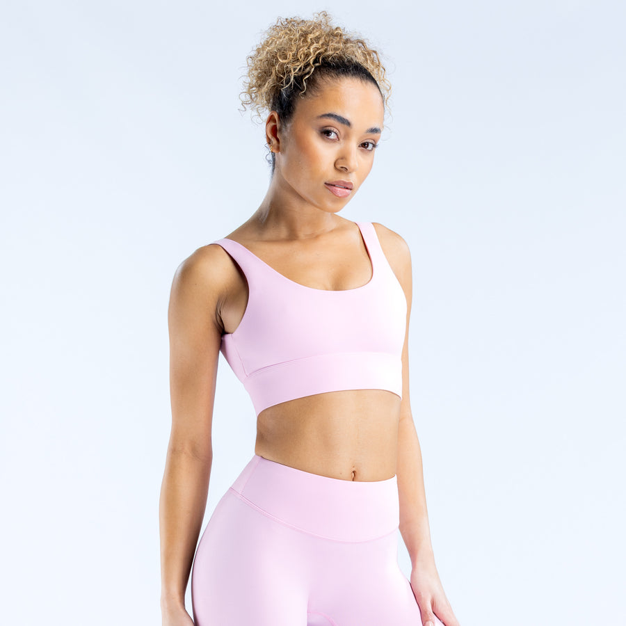 Lilac sports bra with wide straps and scoop neckline, smooth seamless look