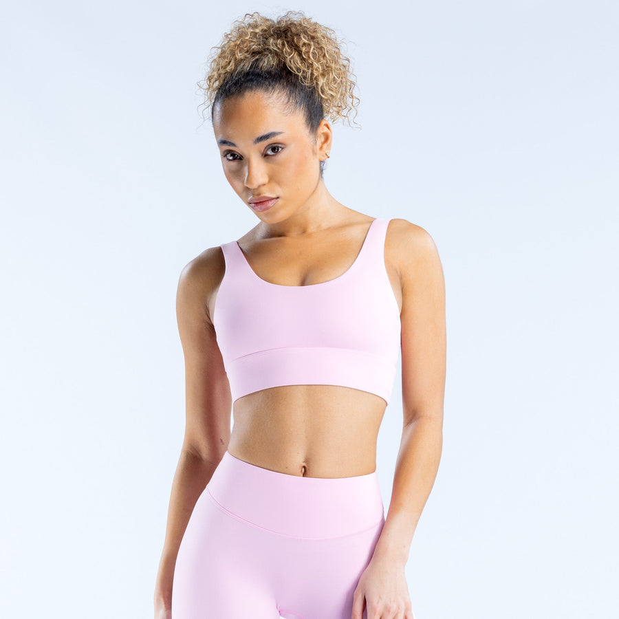 Lavender/pink sports bra with wide straps and smooth racerback design