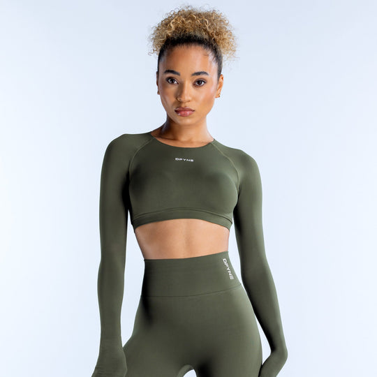 Olive green long-sleeve crop top with crew neck and fitted athletic cut