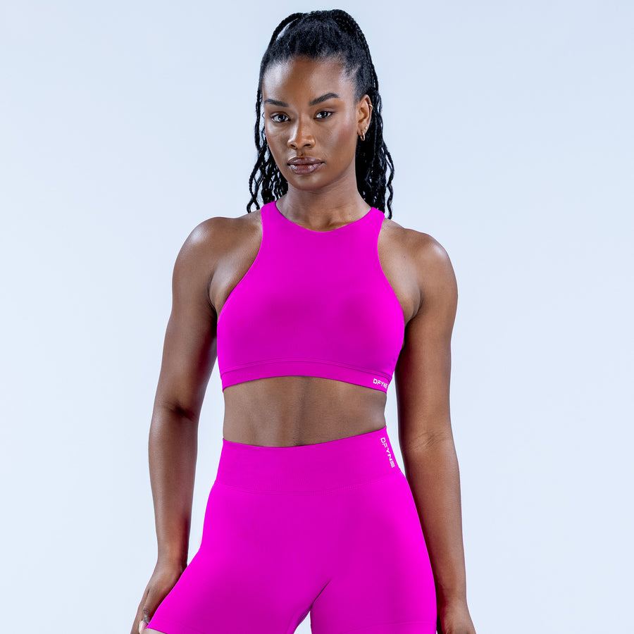 Magenta racerback sports bra with high neckline, front view