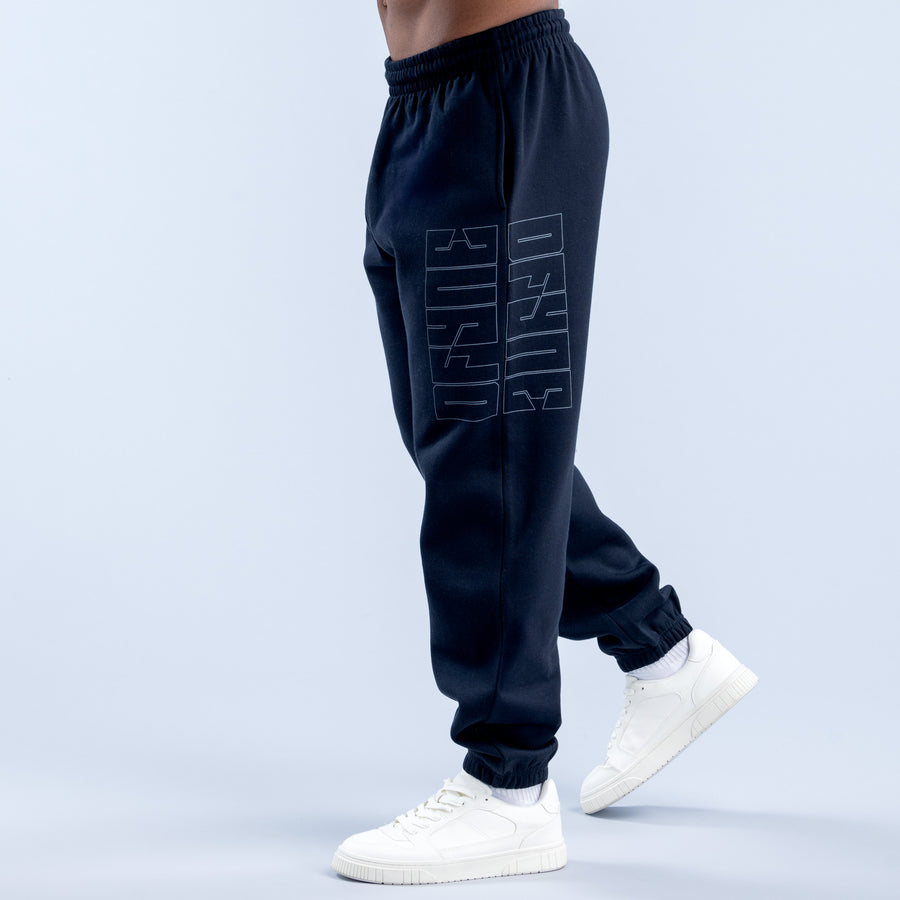 Navy graphic jogger pants with outlined side print and tapered ribbed cuffs