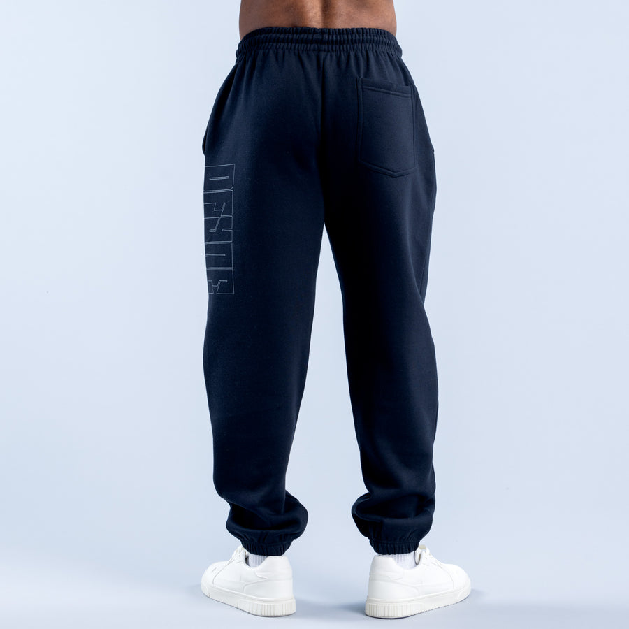 Navy jogger pants with elastic waistband, side pockets, and tapered legs