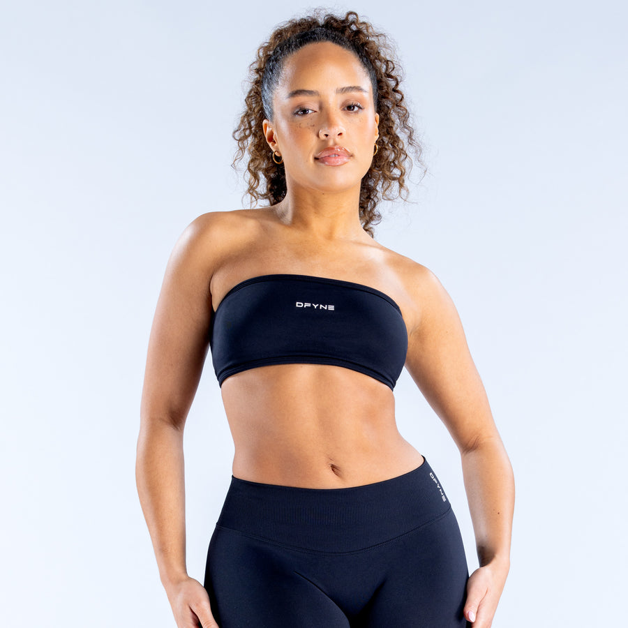 Black bandeau top with strapless neckline and underbust seam
