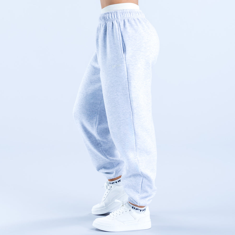 Light blue jogger pants shown from back with elastic waistband and loose leg fit