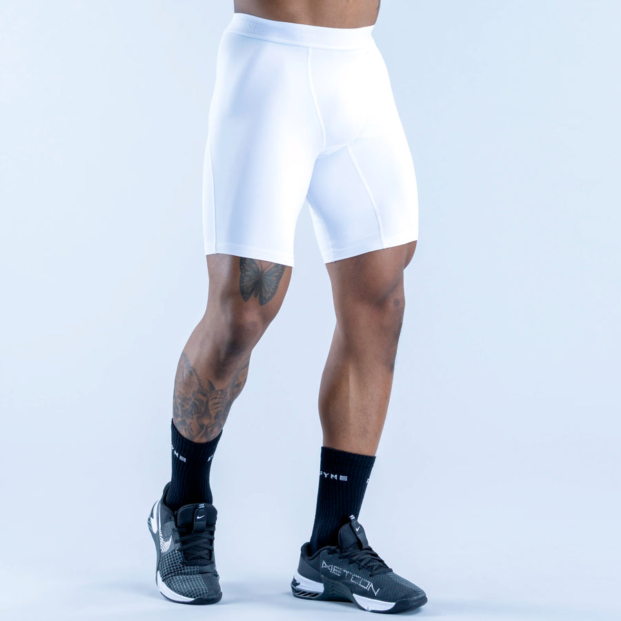 White base-layer cycling shorts with contoured fit and side seam panels