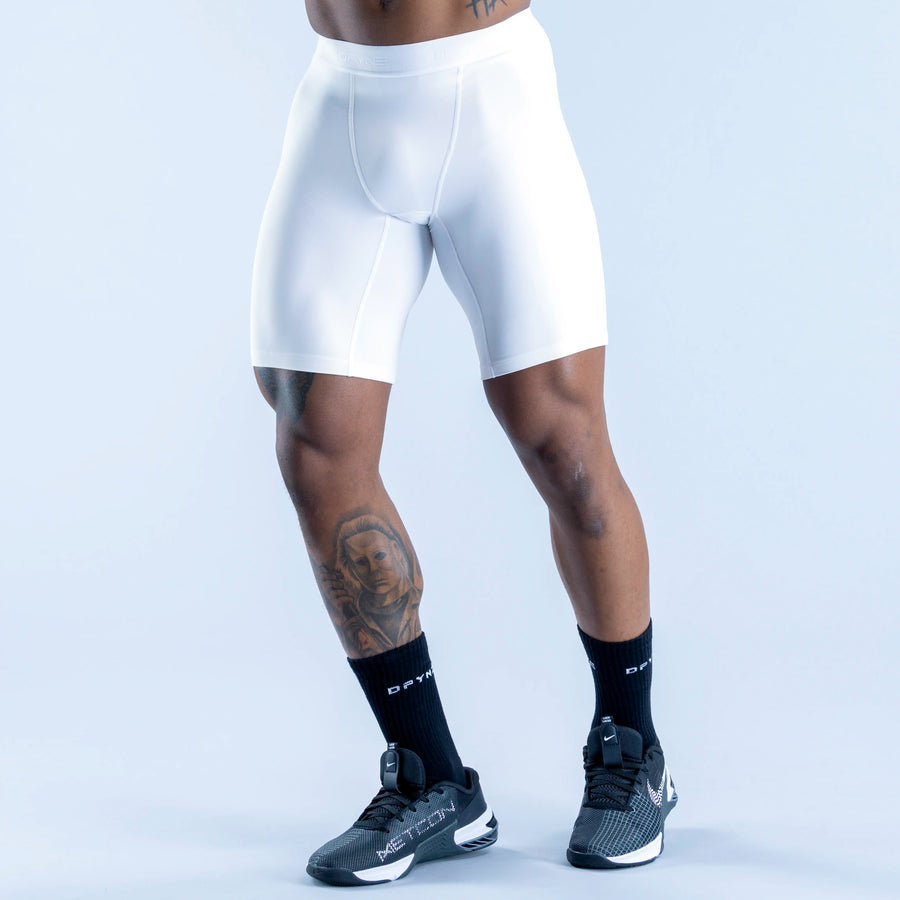 White base layer shorts with contoured front seams and snug compression fit